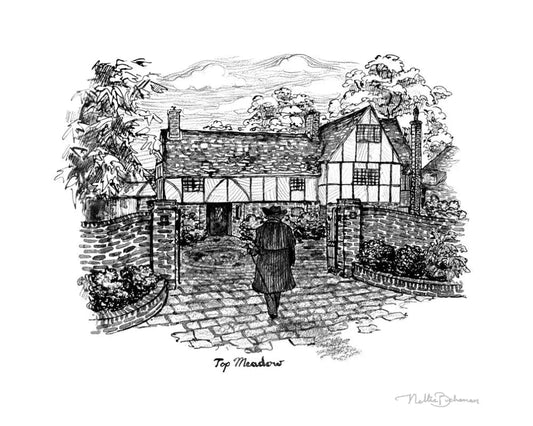 man walking into courtyard of old house